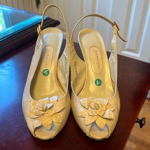 Andrew Keller, beige sling back sandals.